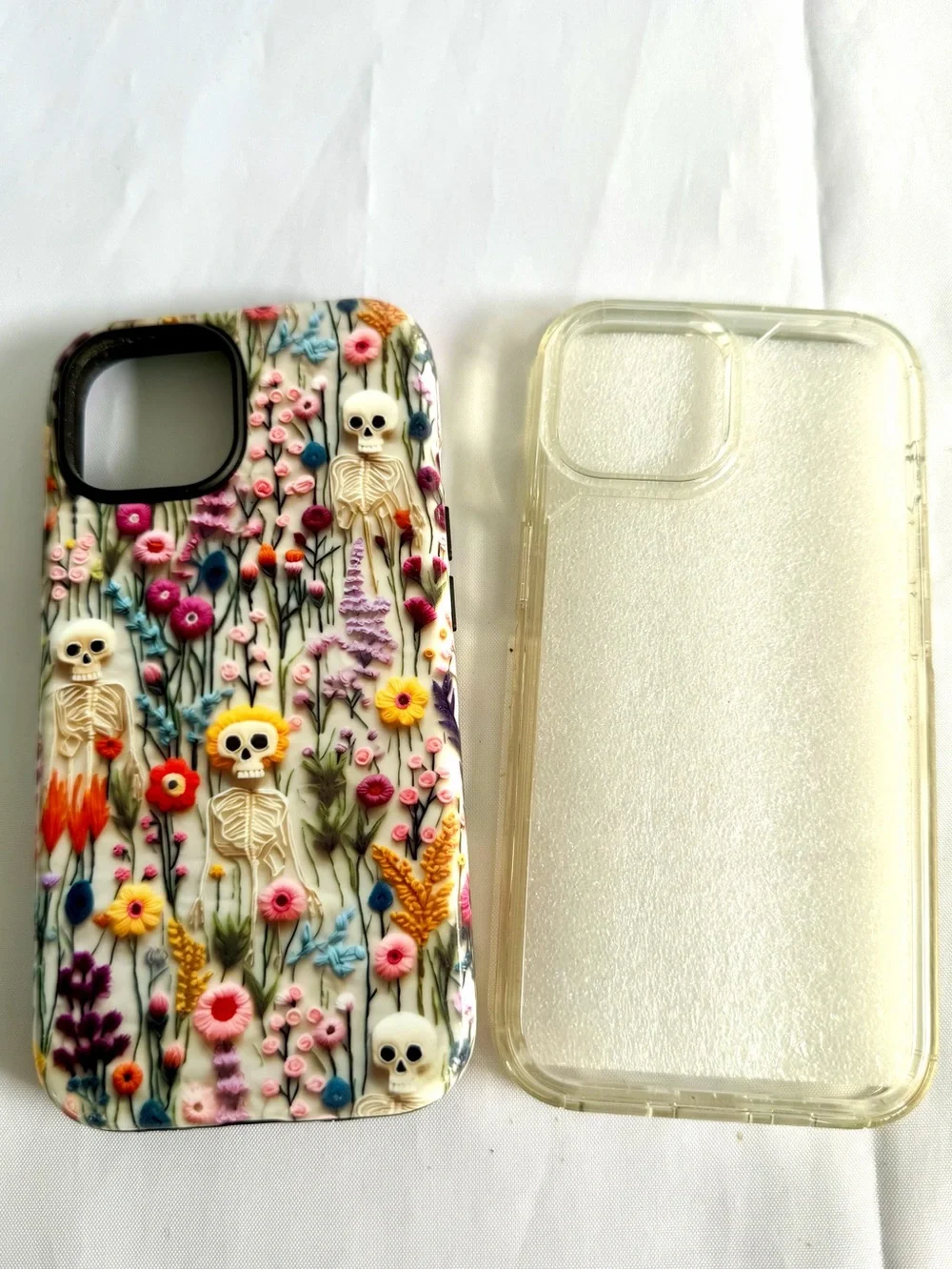 iPhone 15 Phone Cases Lot of 2 Silicone Cases Gently Used Skeleton/Flowers Clear